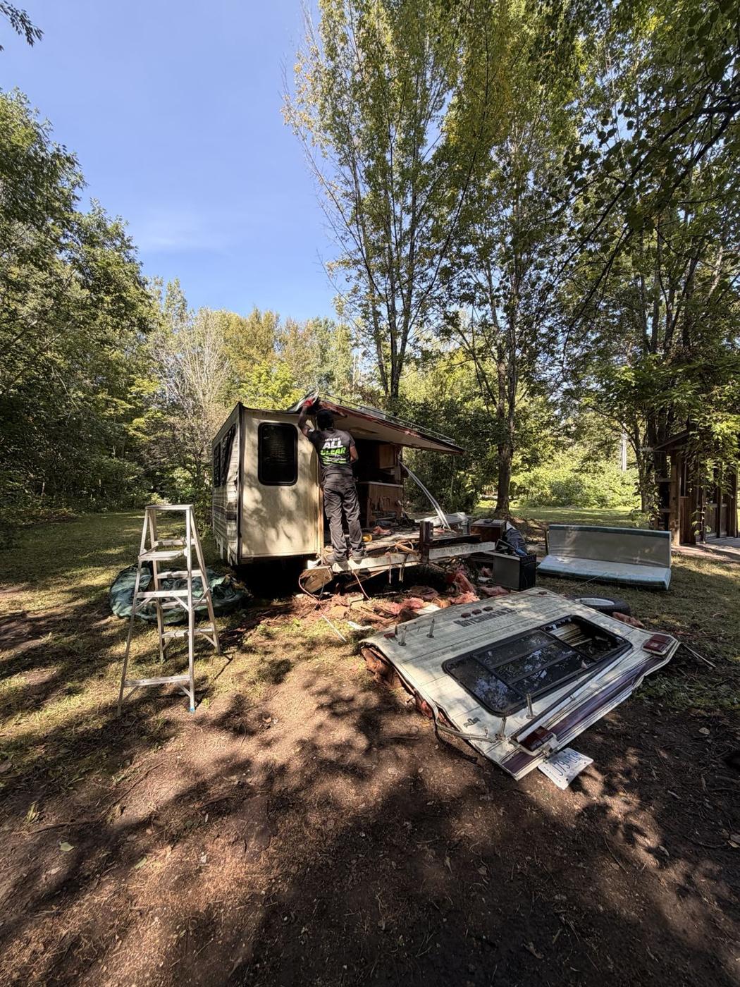 All Clear crew tearing down a camper